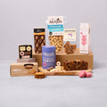 Hot chocolate and sweet treats hamper with cakes, biscuits and macarons
