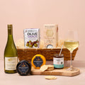 White wine and cheese hamper with crackers, chutney and olives