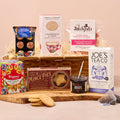 Festive Christmas hamper with mince pies, biscuits, truffles and tea