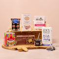 Festive Christmas hamper with mince pies, biscuits, truffles and tea