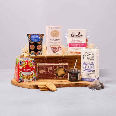 Festive Christmas hamper with mince pies, biscuits, truffles and tea