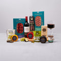 Cheese, red wine and charcuterie hamper with crackers, olives and chutney